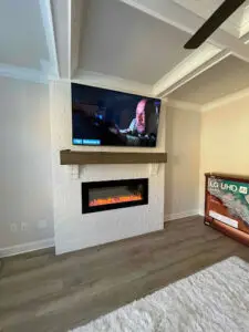 TV installed over a fireplace