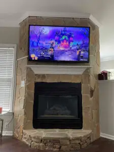 TV installed over a fireplace