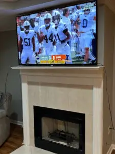 TV installed over a fireplace