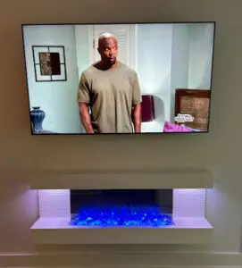 TV installed over a fireplace