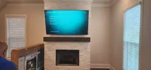 TV installed over a fireplace