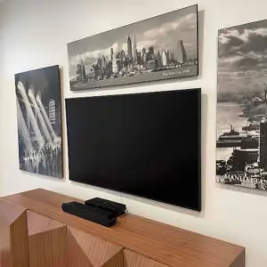 TV mounted on a bedroom wall.