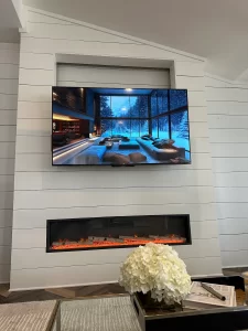 TV installed over a fireplace