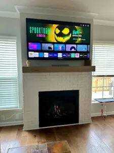 TV installed over a fireplace